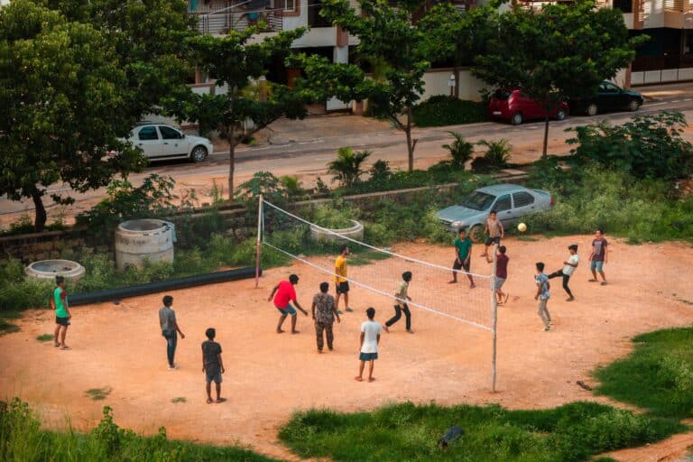 people playing basketball on court during daytime