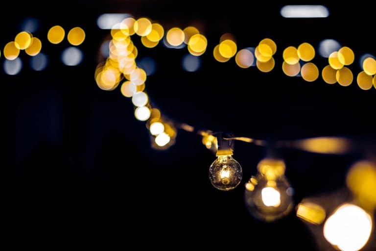How to Hang String Lights in Your Backyard Without Trees